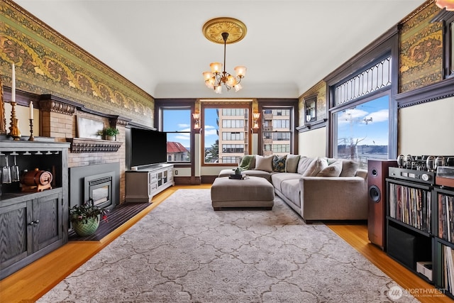 living room featuring a notable chandelier and wood finished floors