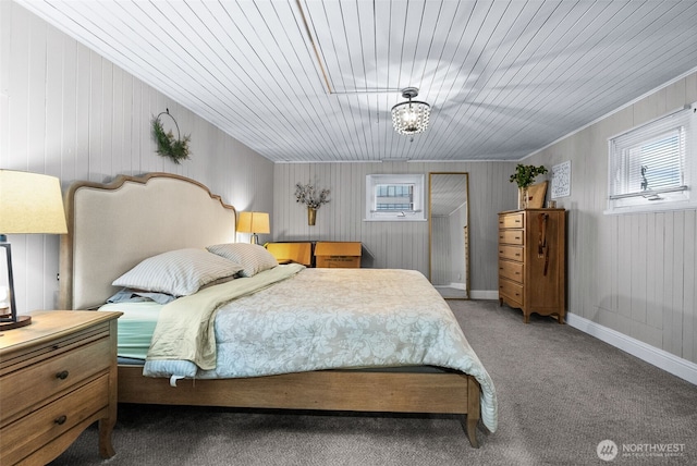 carpeted bedroom featuring baseboards