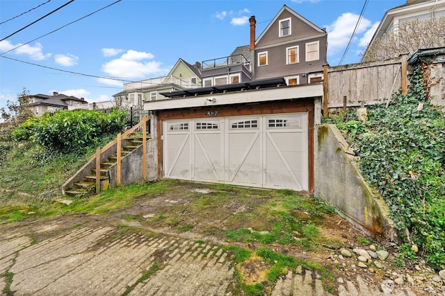 garage with fence