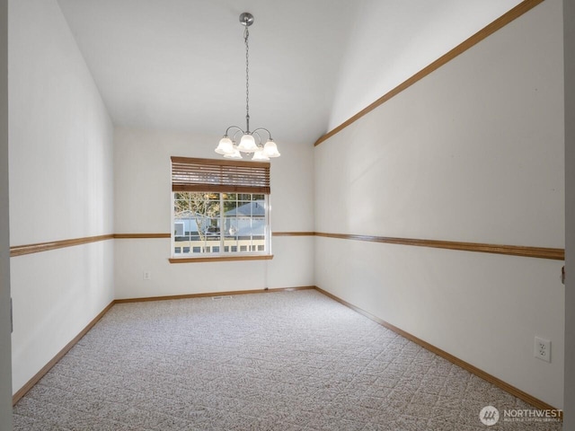 spare room with baseboards, lofted ceiling, a chandelier, and carpet flooring