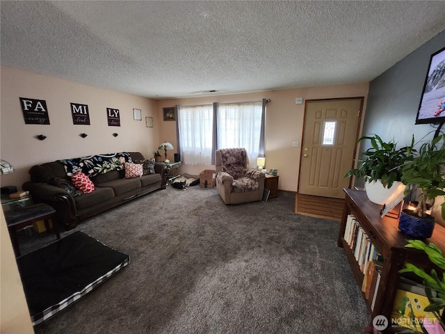 carpeted living room featuring a textured ceiling