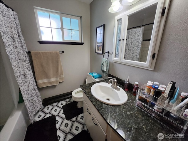 bathroom with toilet and vanity