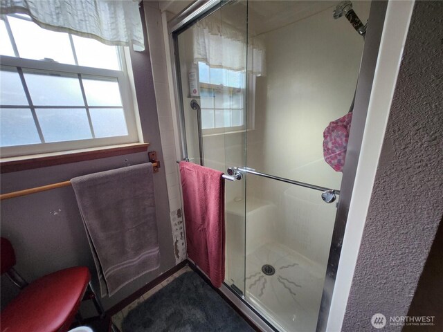 full bath featuring a stall shower