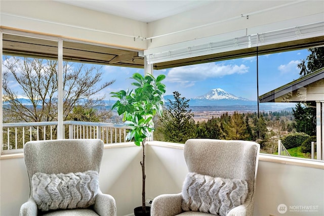 sunroom featuring a mountain view