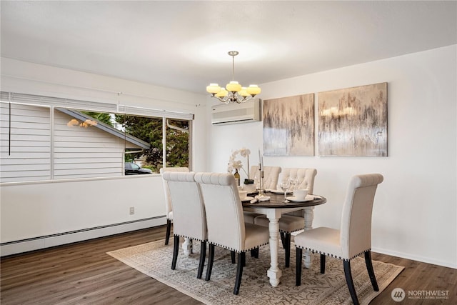 dining area with a chandelier, a baseboard heating unit, a wall mounted air conditioner, and wood finished floors