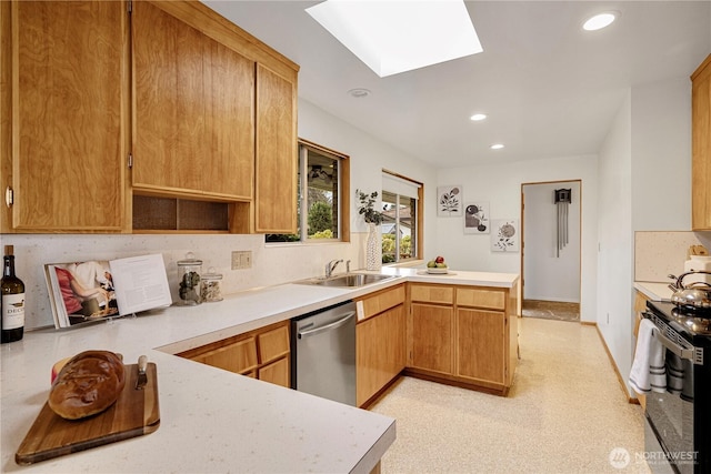 kitchen with a peninsula, range with electric stovetop, a skylight, a sink, and stainless steel dishwasher