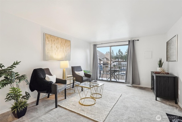 sitting room with carpet and baseboards