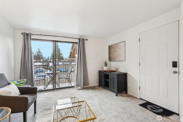 living room with baseboards and carpet floors