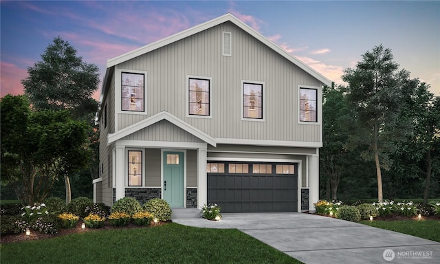 view of front facade with stone siding, driveway, and an attached garage