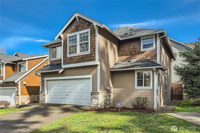 view of front facade featuring driveway, an attached garage, and a shingled roof