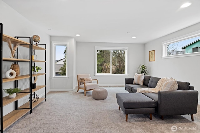 carpeted living room with recessed lighting, a healthy amount of sunlight, and baseboards