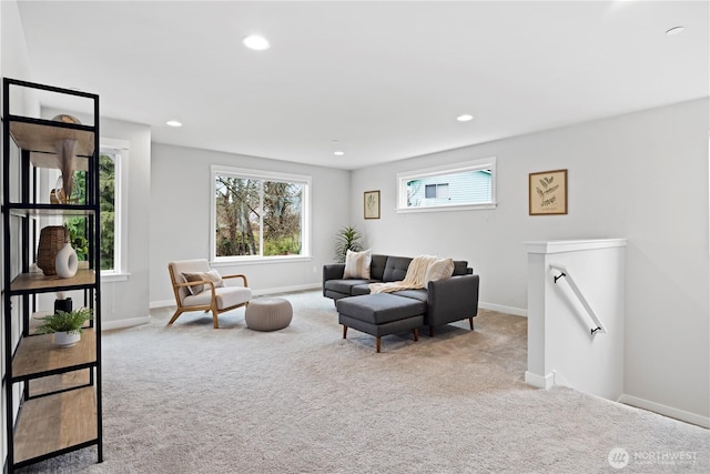 sitting room with recessed lighting, baseboards, carpet flooring, and an upstairs landing