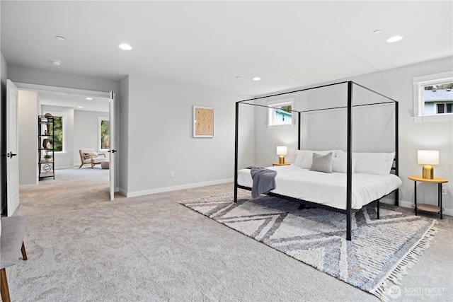 carpeted bedroom featuring baseboards and recessed lighting