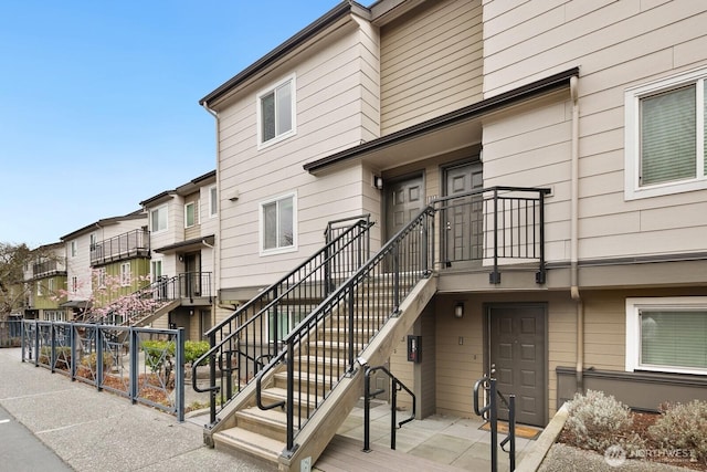 view of property featuring stairway