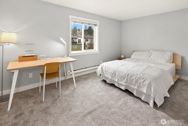 carpeted bedroom featuring baseboard heating and baseboards