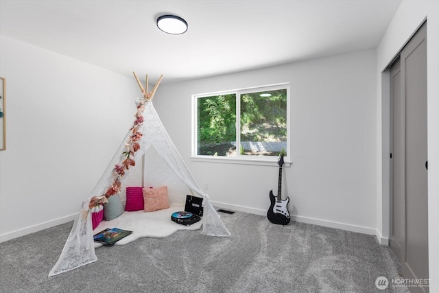 rec room featuring carpet flooring, visible vents, and baseboards