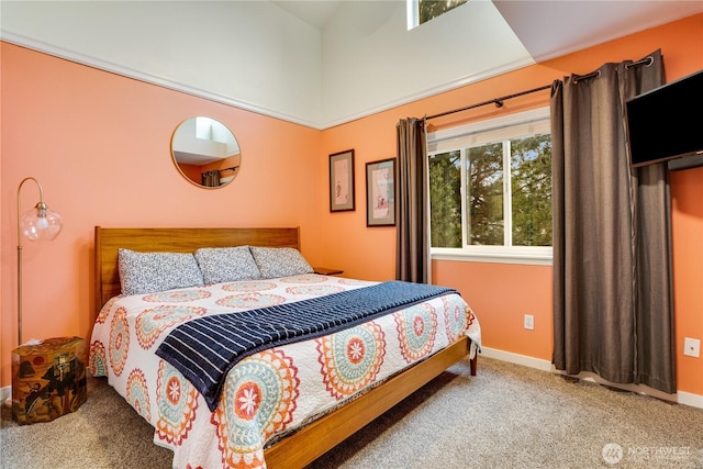 bedroom with carpet and baseboards