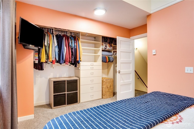 carpeted bedroom with baseboards