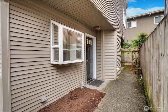 doorway to property with fence