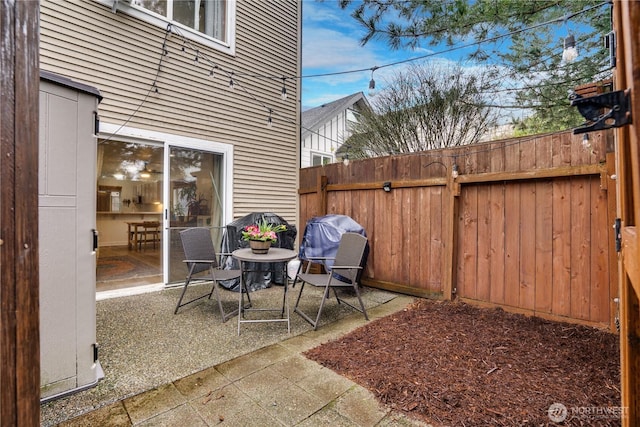 view of patio featuring fence