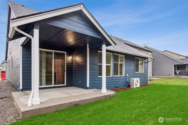 back of property featuring ac unit, a shingled roof, a lawn, and a patio