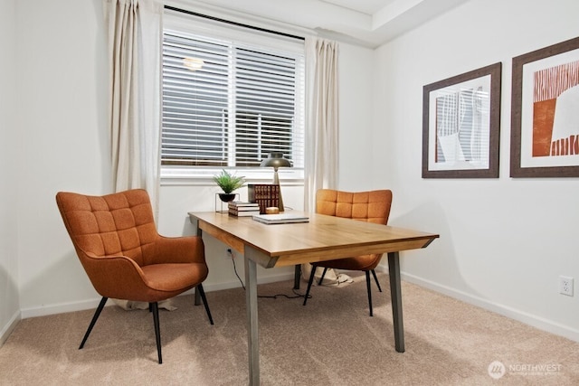 carpeted home office featuring baseboards