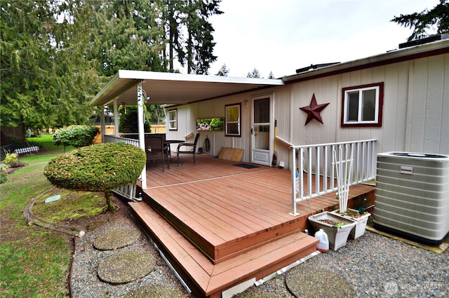 deck with central air condition unit and outdoor dining space