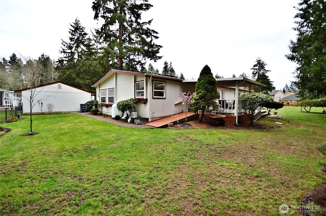 exterior space featuring a deck and a lawn