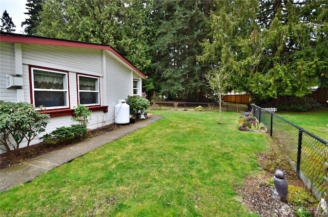 view of yard with a fenced backyard