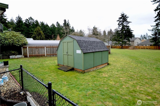 view of shed with a fenced backyard