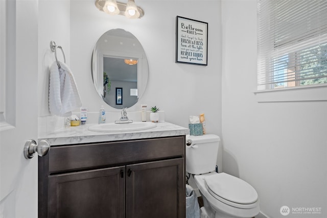 bathroom with vanity and toilet