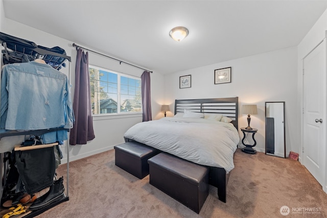 bedroom with carpet and baseboards