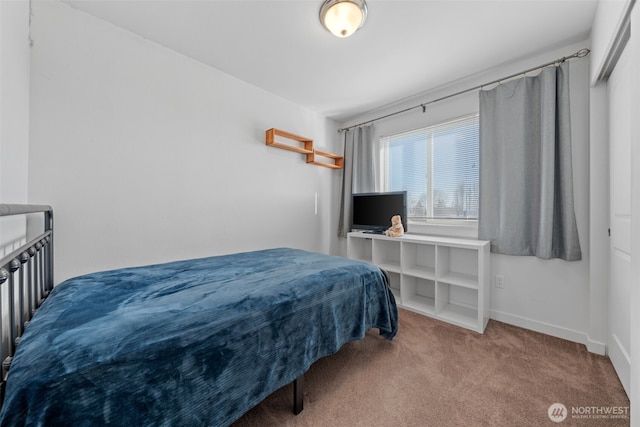 bedroom with baseboards and carpet flooring