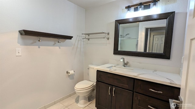 bathroom with toilet, tile patterned flooring, a shower, baseboards, and vanity