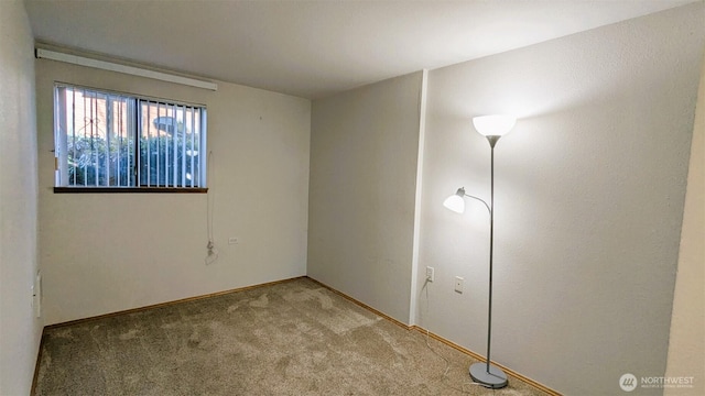 empty room featuring light colored carpet