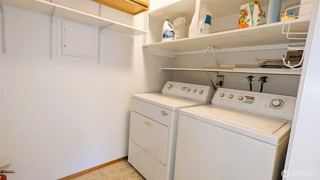 laundry area featuring washer and clothes dryer, laundry area, and baseboards