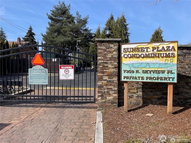 exterior space featuring fence and a gate