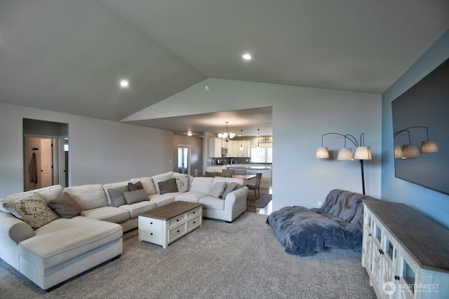 carpeted living room with lofted ceiling, recessed lighting, and an inviting chandelier