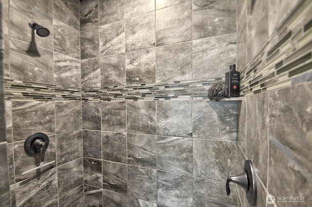 details featuring tiled shower