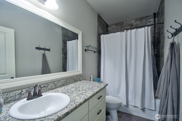 full bathroom featuring toilet, vanity, and shower / tub combo with curtain