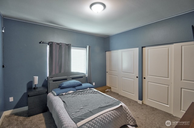 bedroom featuring baseboards and carpet flooring