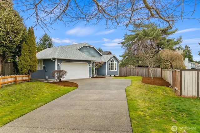 view of front of house with driveway, a shingled roof, an attached garage, fence private yard, and a front yard