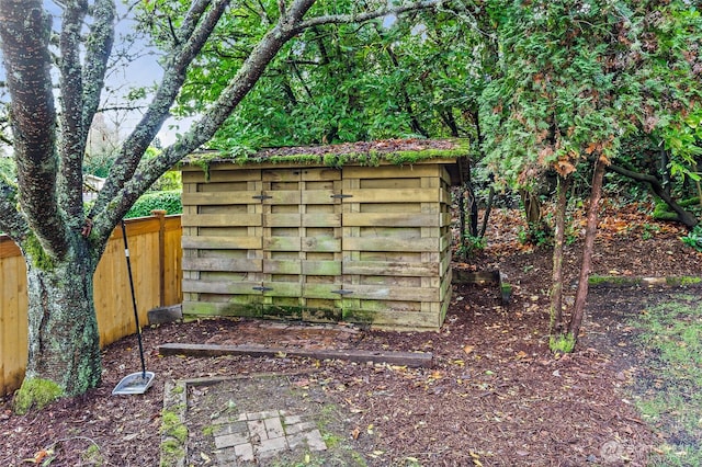 view of outdoor structure featuring fence