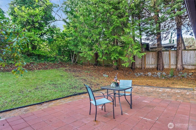 view of patio / terrace featuring fence and outdoor dining space