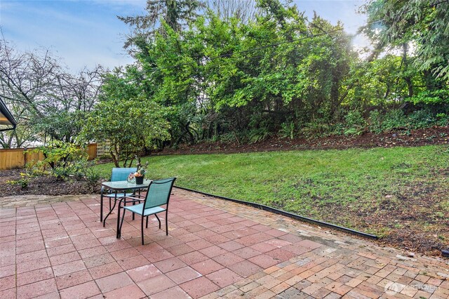 view of patio / terrace featuring outdoor dining area and fence