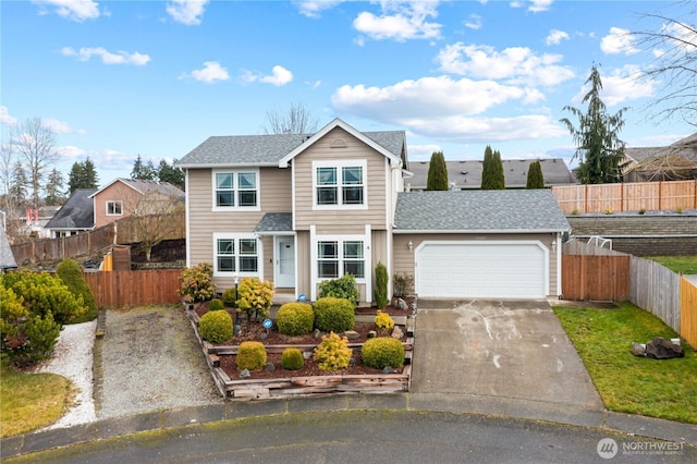 traditional-style home featuring a garage, driveway, a shingled roof, and fence