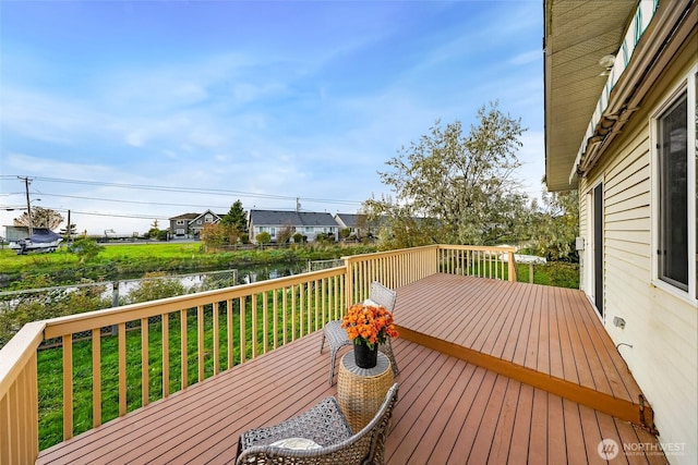 deck featuring a water view