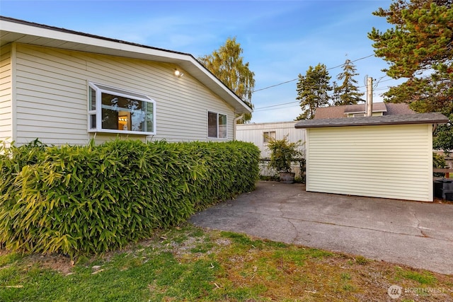 view of property exterior with a patio