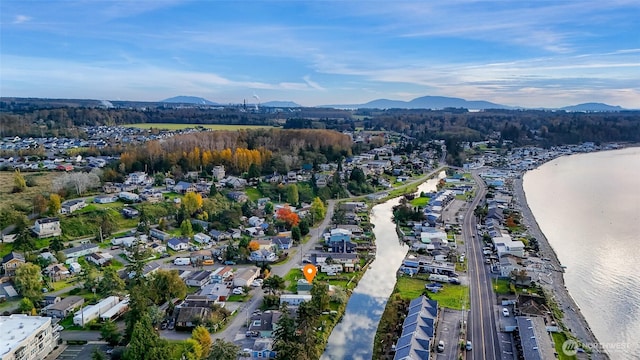 birds eye view of property featuring a water and mountain view