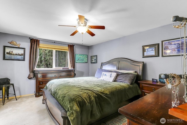 bedroom featuring light carpet, ceiling fan, and baseboards